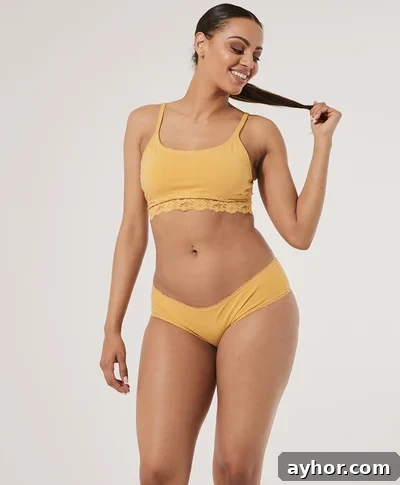 a woman wearing yellow 100% organic cotton plus size underwear from Pact