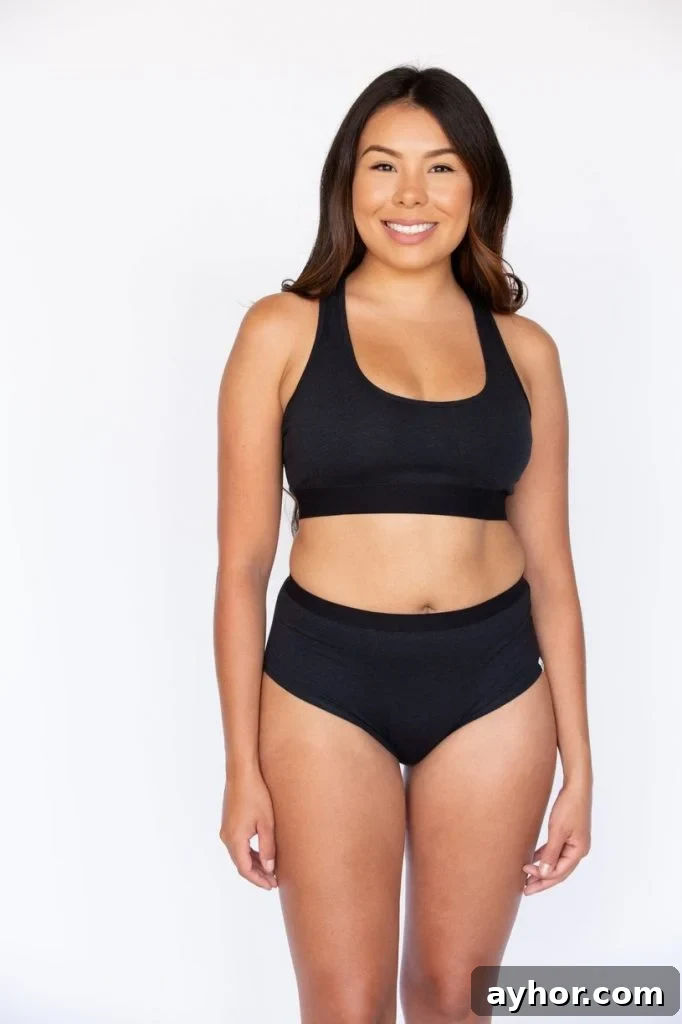 a woman wearing black 100% organic cotton plus size underwear from WAMA