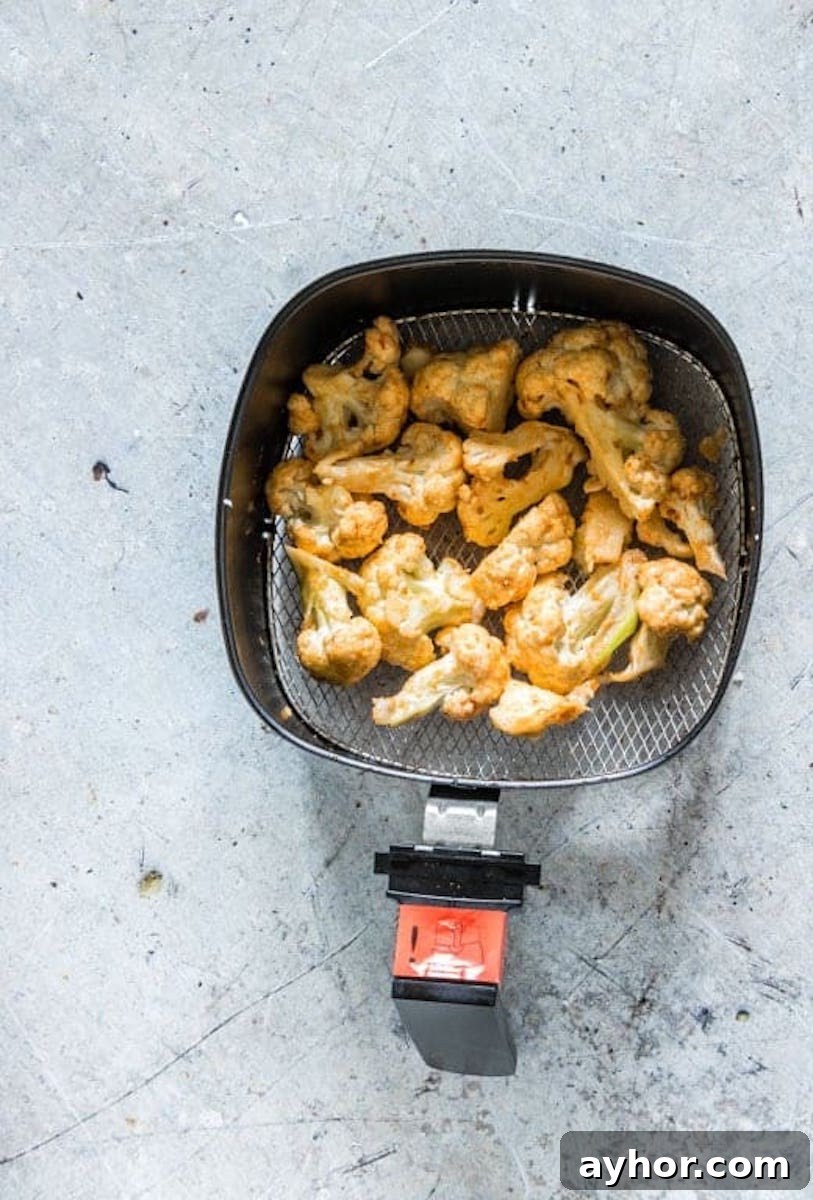 Crispy Air-Fryer Cauliflower Wings with Spicy Dipping Sauce 6 the cooked cauliflower wings air fryer basket