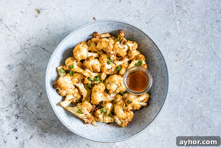 Crispy Air-Fryer Cauliflower Wings with Spicy Dipping Sauce 8 top down view of the completed cauliflower wings in a bowl