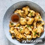 Crispy Air-Fryer Cauliflower Wings with Spicy Dipping Sauce 10 air fryer buffalo cauliflower wings in a aplate