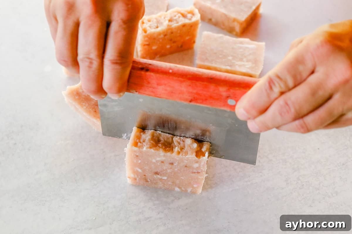 Cutting the rebatch soap into individual bars.