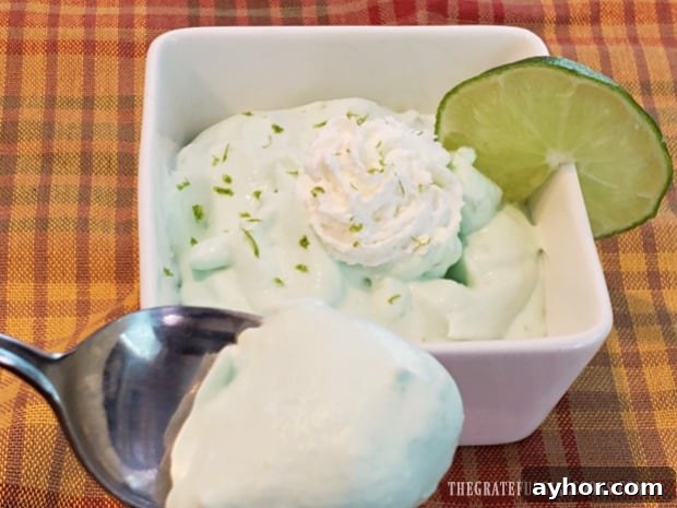 Serve and enjoy Spoonful of creamy lime mousse