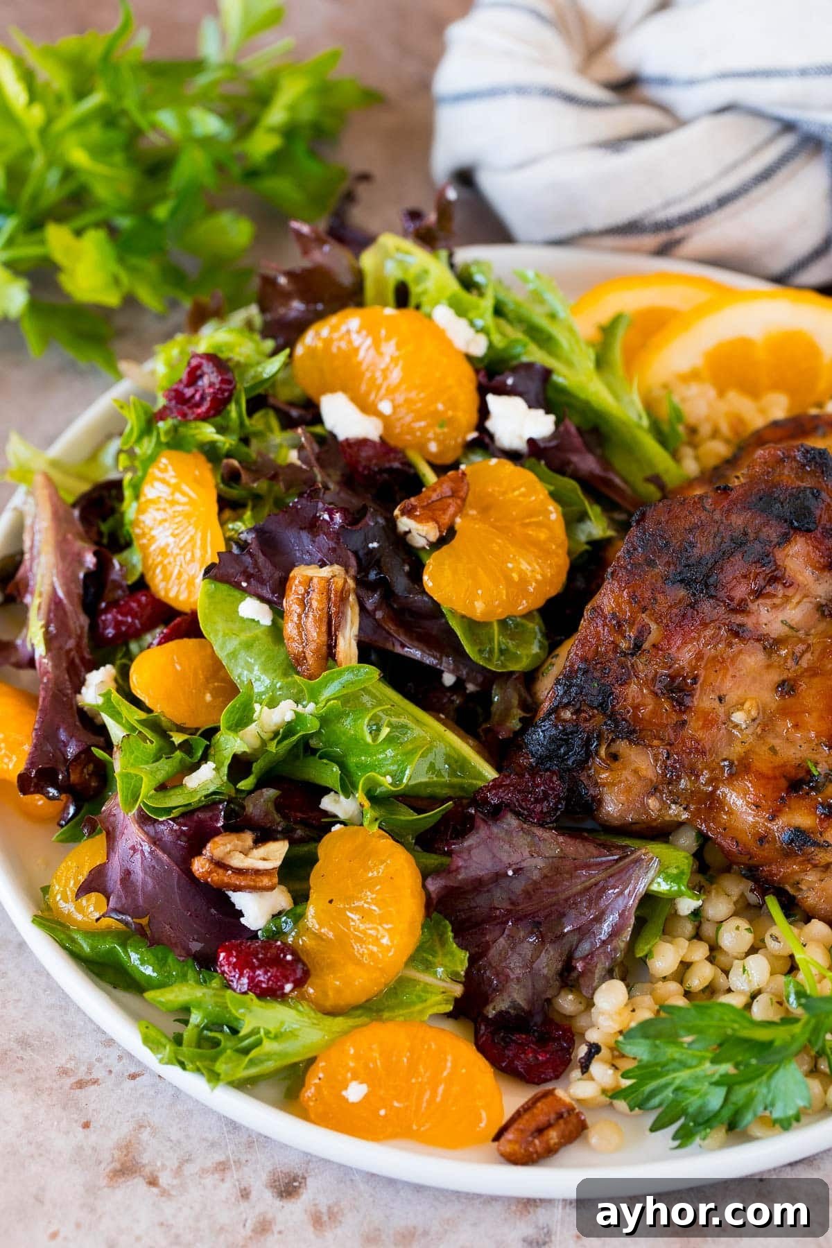 A plate of mandarin orange salad served with chicken.