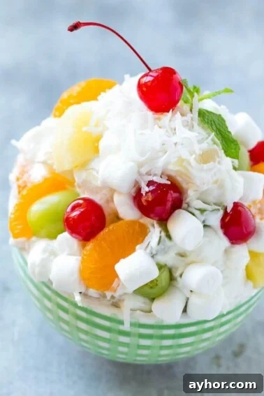 This recipe for ambrosia salad is a variety of colorful fruit with marshmallows and coconut, tossed in a light and creamy dressing. An easy salad that's a classic for good reason, people always beg me for the recipe!