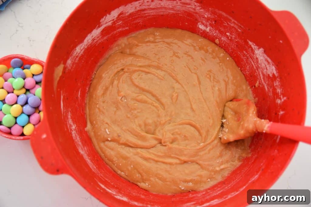 Easter Blondie Bars with Marshmallow Eggs Recipe 6 blondie batter in red bowl
