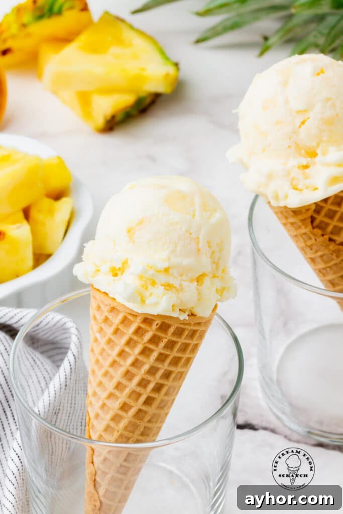 Pineapple ice cream in a cone
