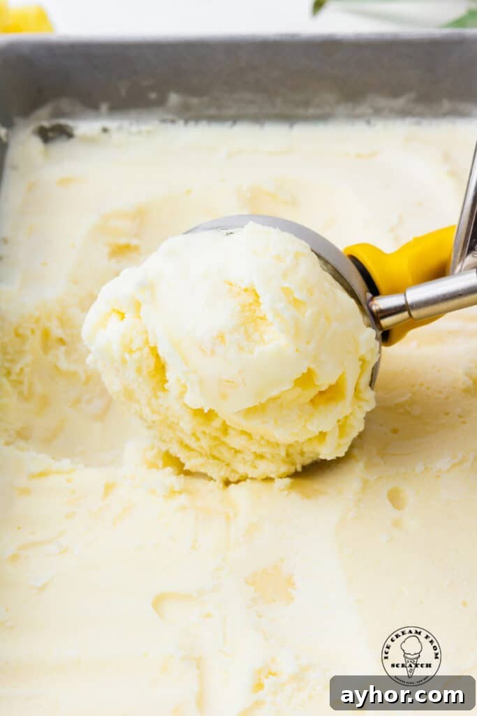 scooper scooping pineapple ice cream