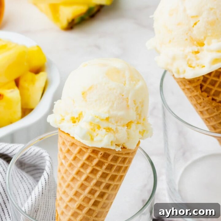 Pineapple ice cream in a cone