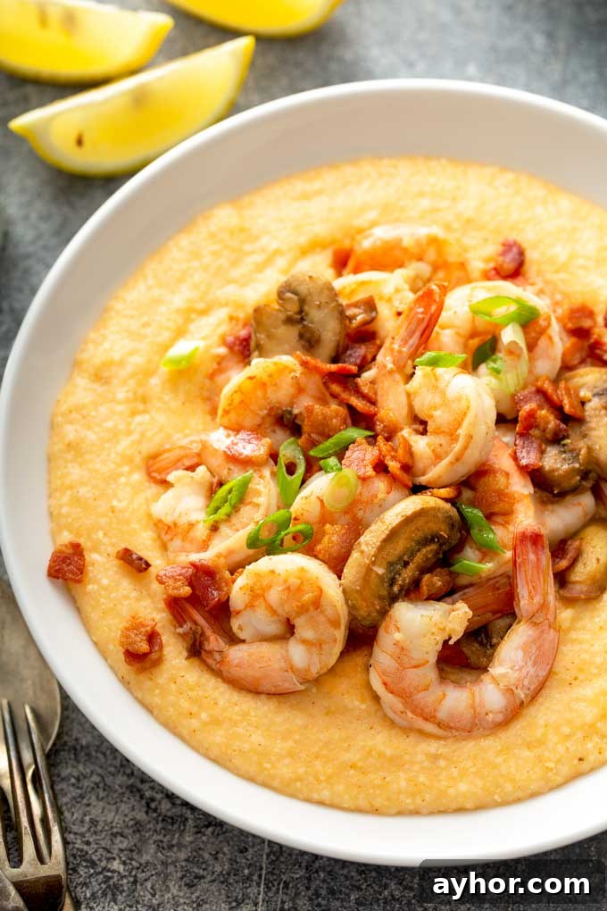 Cajun Shrimp and Grits: Creamy Southern Comfort Recipe 3 top view of Bowls filled with cheesy grits and topped with shrimp