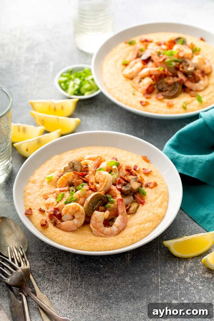 Cajun Shrimp and Grits: Creamy Southern Comfort Recipe 4 Two bowls filled with creamy grits and shrimp.