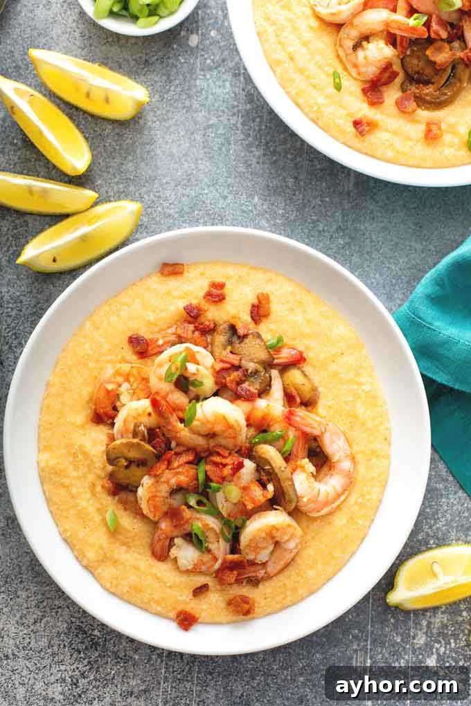 Cajun Shrimp and Grits: Creamy Southern Comfort Recipe 7 top view of two Bowls filled with cheesy grits and topped with shrimp,