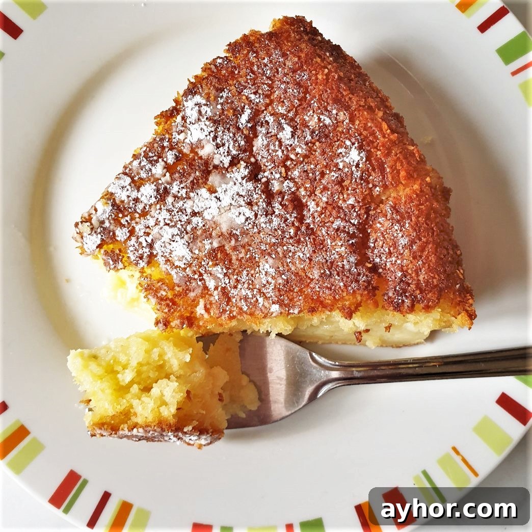 Classic Coconut Cream Pie Recipe for Homemade Dessert 7 A slice of coconut pie on a plate with a fork.