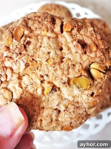 Close up of a pistachio butter biscuit.
