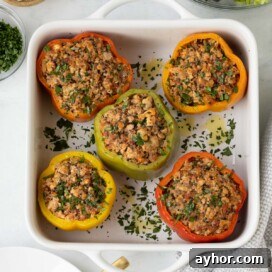 Ground Turkey Stuffed Peppers with Savory Tomato Rice 14 Colorful baked ground turkey stuffed peppers with quinoa and herbs.