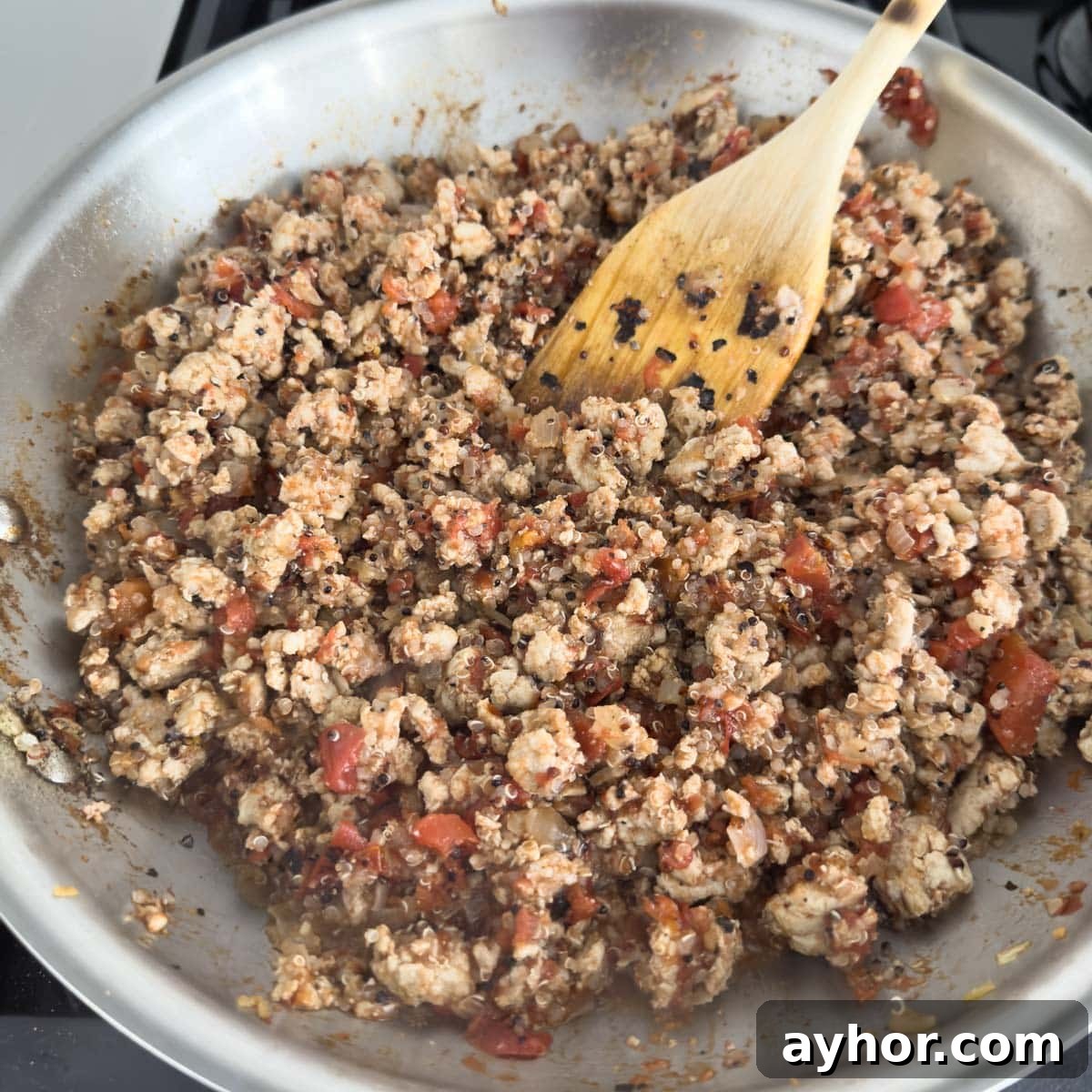 Ground Turkey Stuffed Peppers with Savory Tomato Rice 7 Cooked turkey and other ingredients for stuffed peppers.