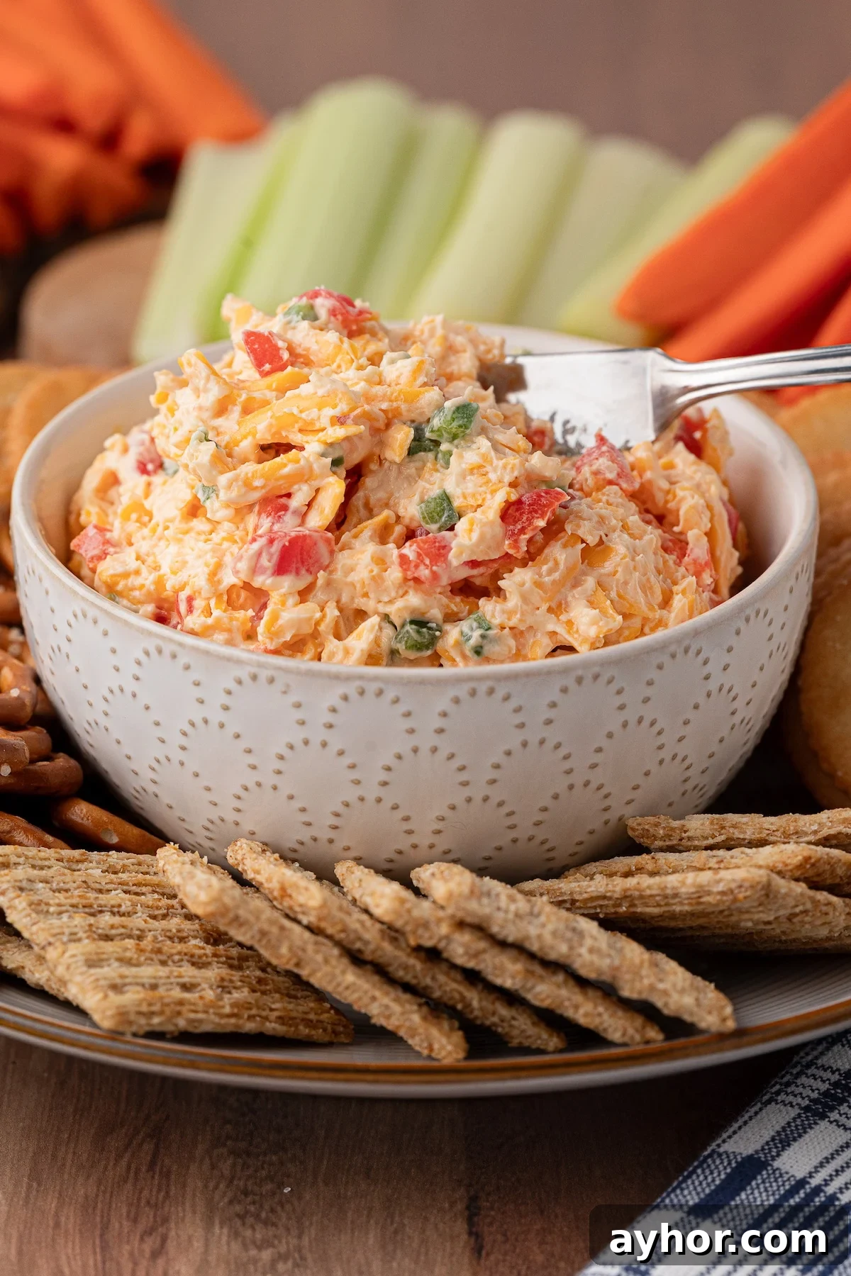 bowl of pimento cheese with visible jalapeños and pimentos