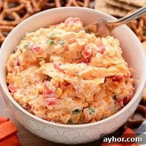 bowl of jalapeno pimento cheese with creamy texture and visible pimento and jalapeno