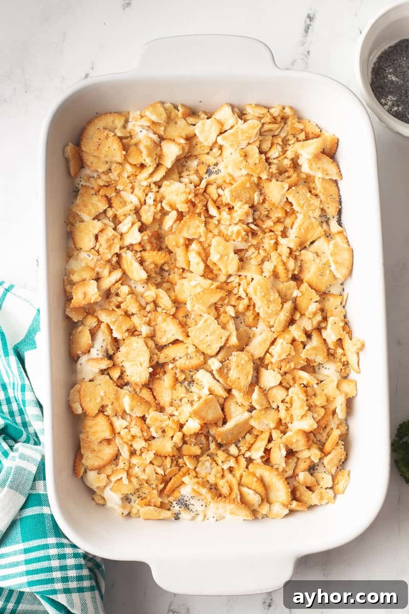 Buttery Ritz cracker topping is sprinkled on top of the poppy seed chicken.