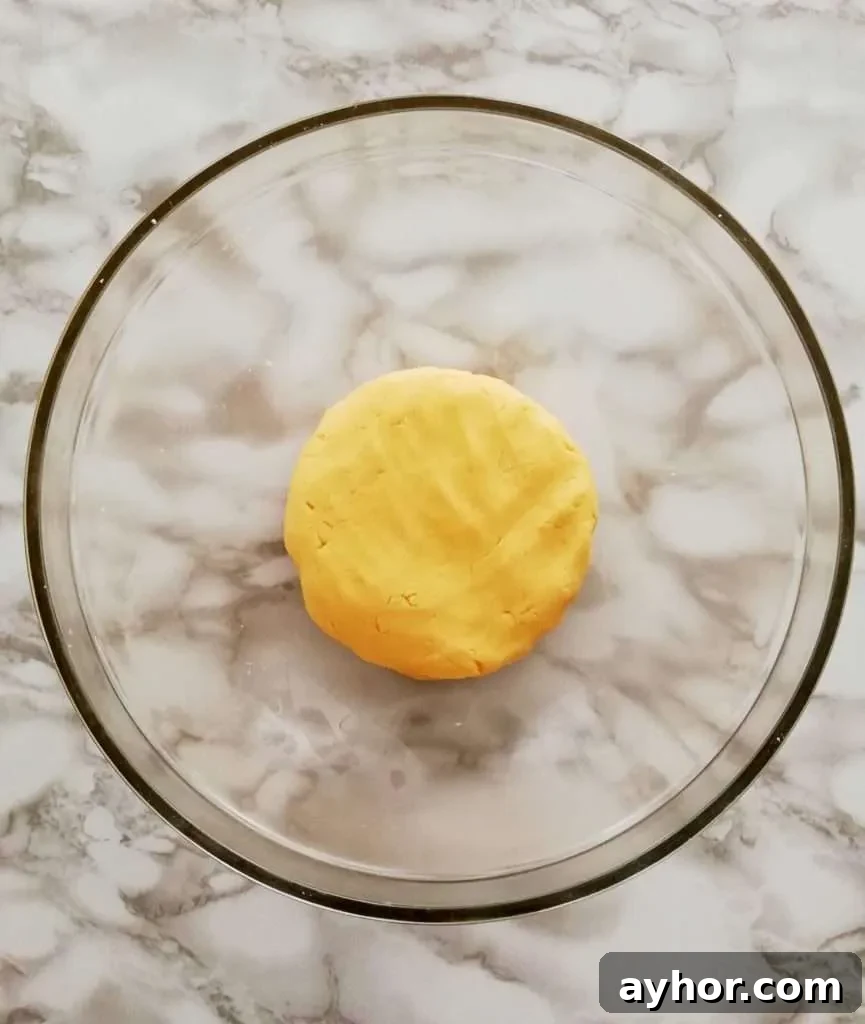 apricot jam filled sandwich cookie dough in bowl