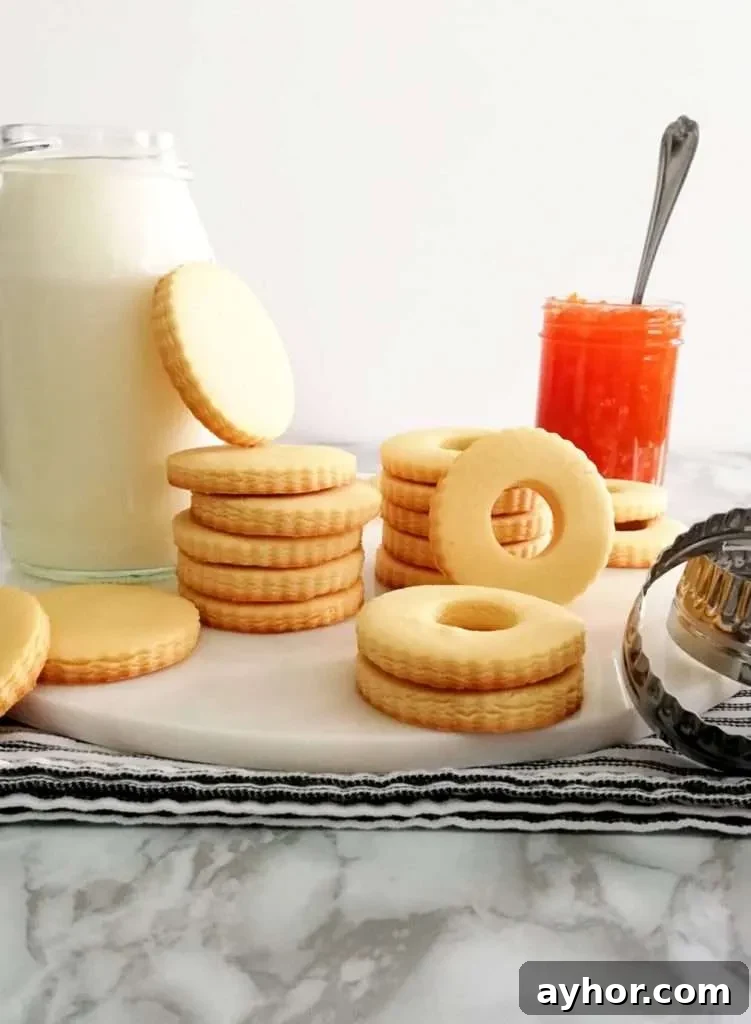 apricot jam filled sandwich cookies baked cookie dough ready to fill with jam