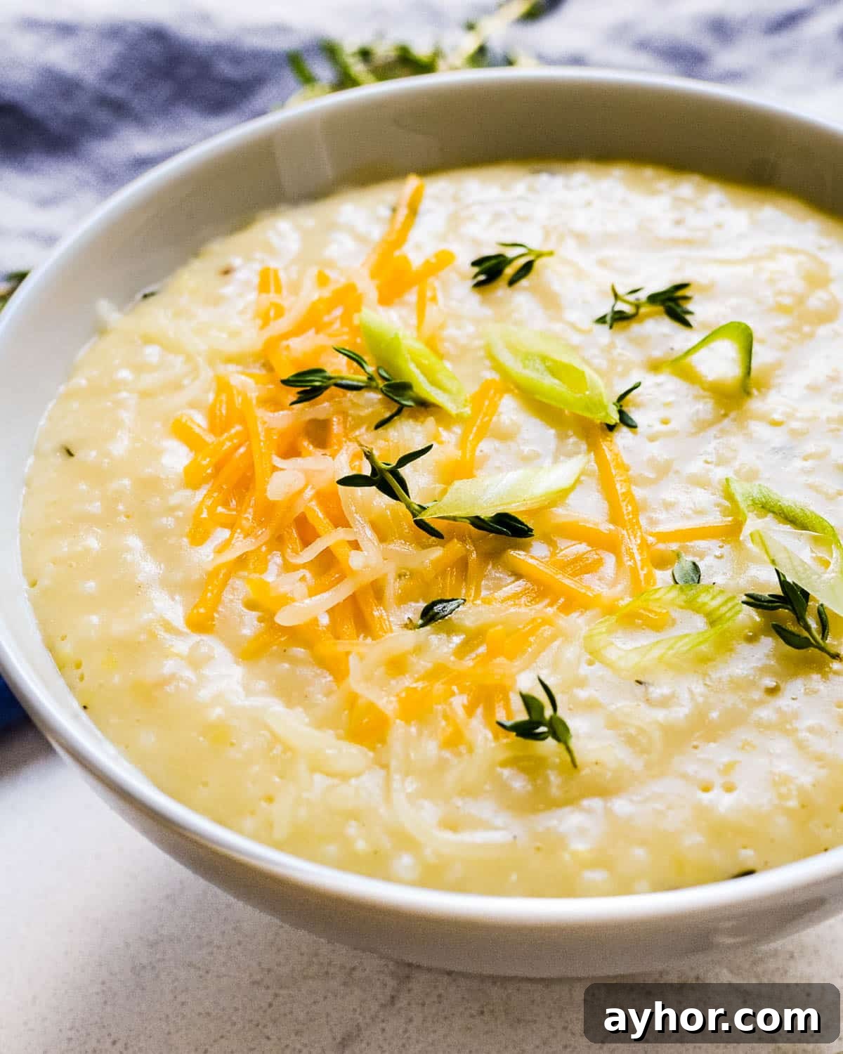 Creamy Roasted Garlic Grits with Melted Cheese 7 A bowl of cheese grits.