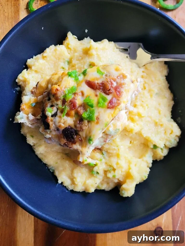 Jalapeño Popper Stuffed Chicken Breast with Creamy Cheese Filling 11 plate of jalapeno popper chicken with cheesy polenta
