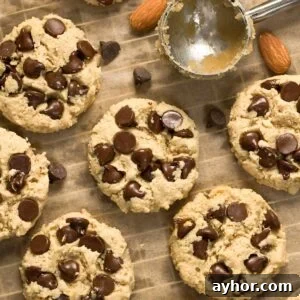 Gluten-free chocolate chip cookies on a cookie sheet.