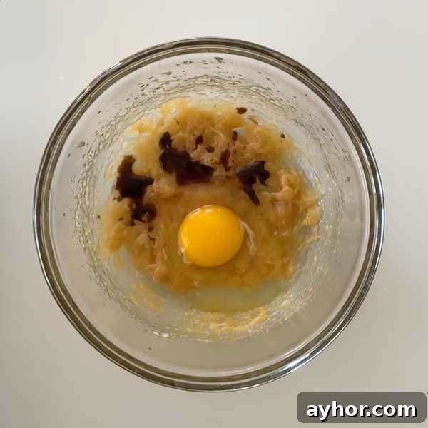 Adding wet ingredients to batter.