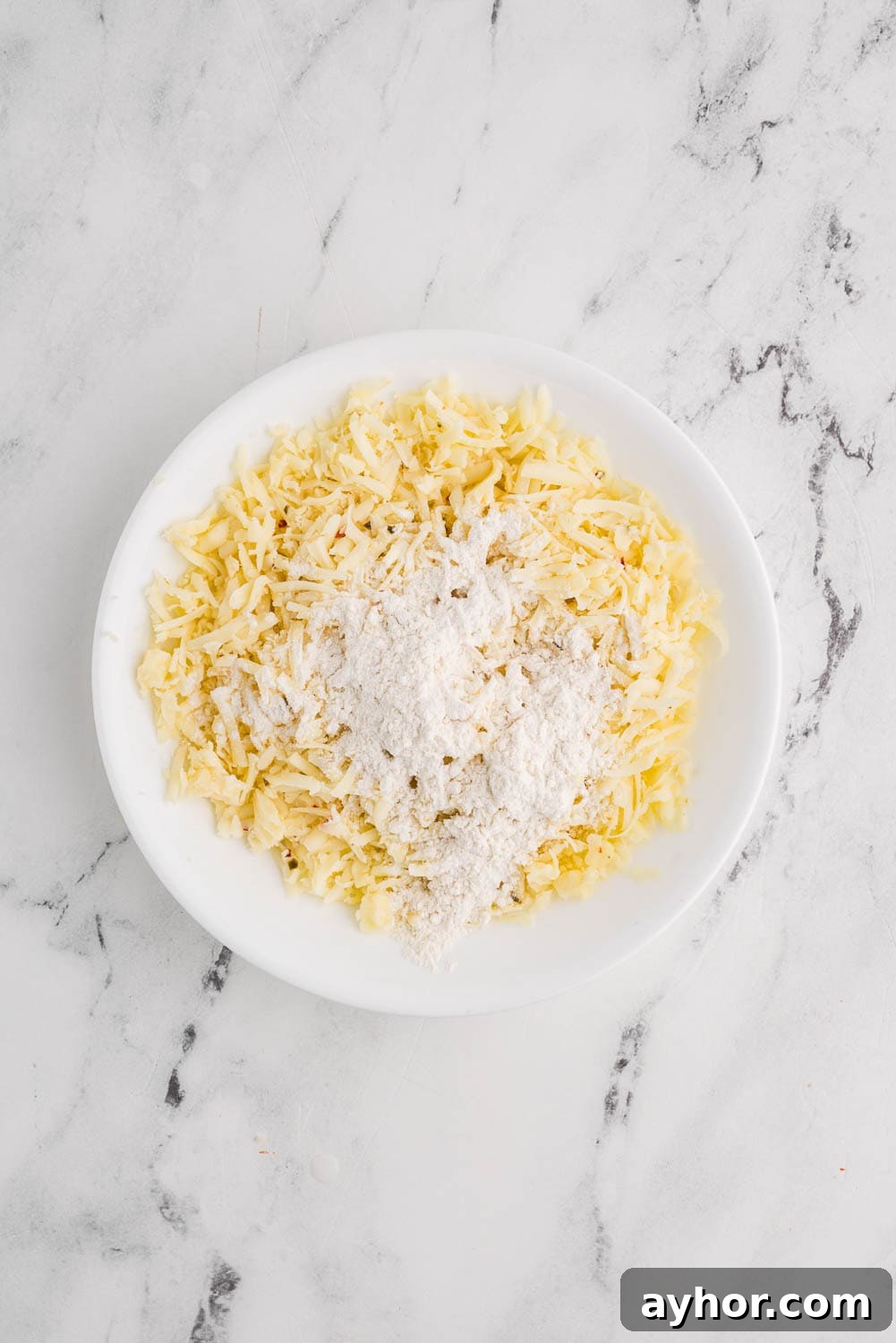 shredded pepper and jack cheese in a bowl ready to prepare a recipe
