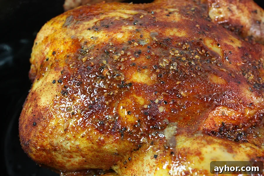 Slow cooker roasted chicken in a crock pot.
