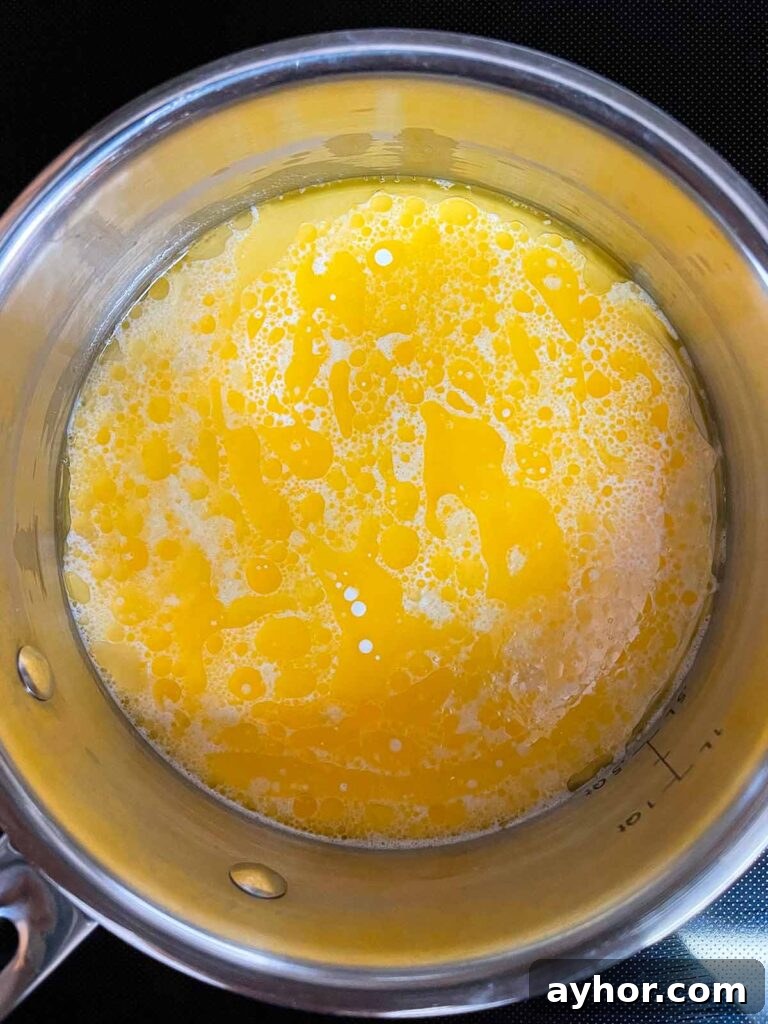Butter, herbs, and heavy cream in a sauce pan.