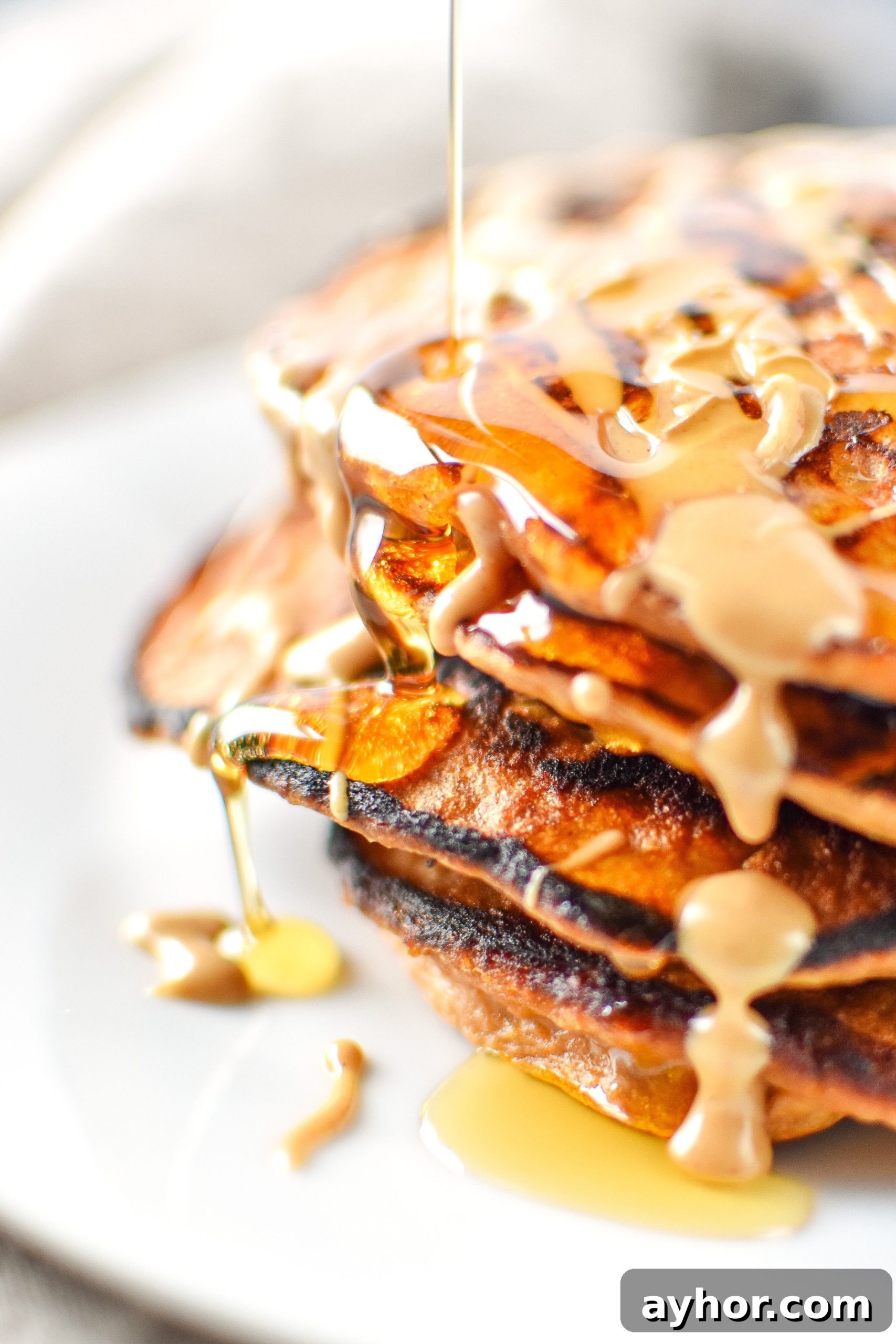 5-Ingredient Sweet Potato Banana Pancakes - Banana, sweet potato, nut butter, eggs and cinnamon are all you need to make these simple pancakes happen. Maple syrup drizzled on top is the best!