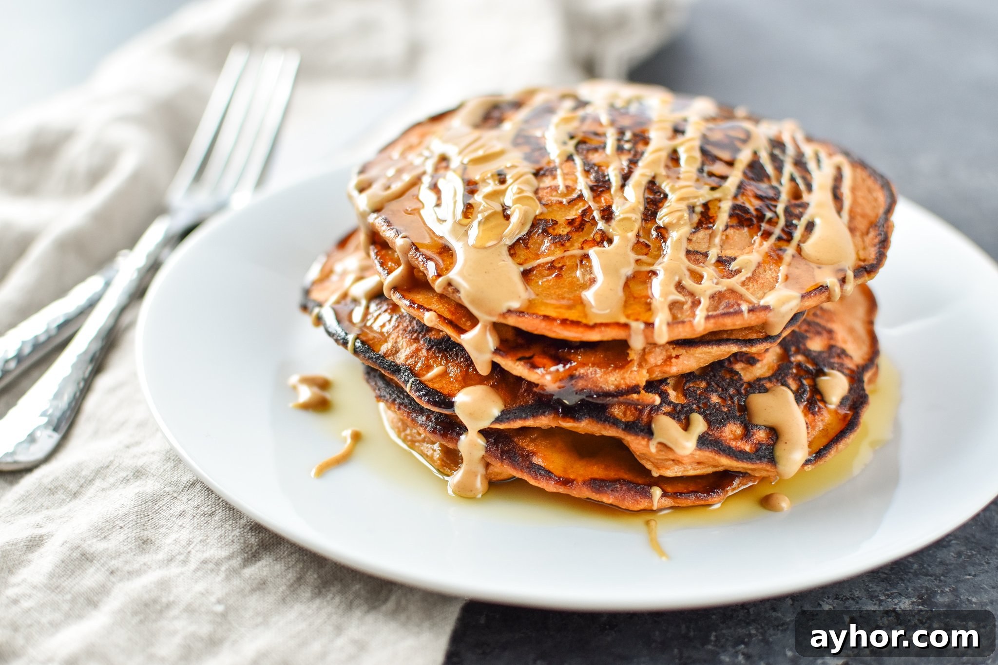 5-Ingredient Sweet Potato Banana Pancakes - Banana, sweet potato, nut butter, eggs and cinnamon are all you need to make these simple pancakes happen. - ProjectMealPlan.com