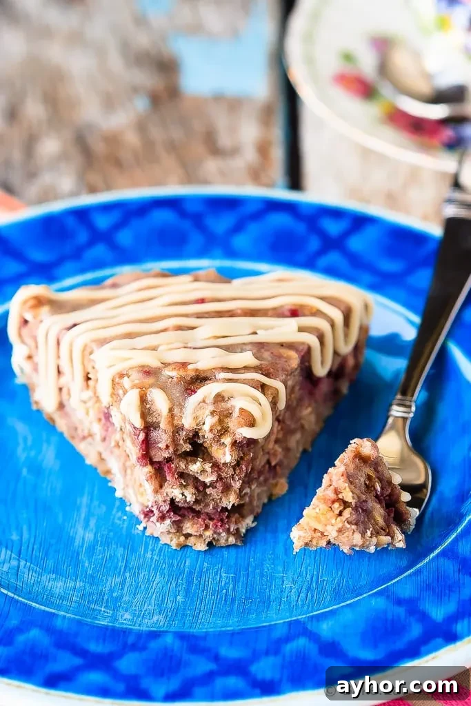 Banana Berry Oatmeal Cake - This banana berry oatmeal cake with a vanilla glaze is quick and easy to whip up, and makes a fantastic breakfast or a healthy snack!
