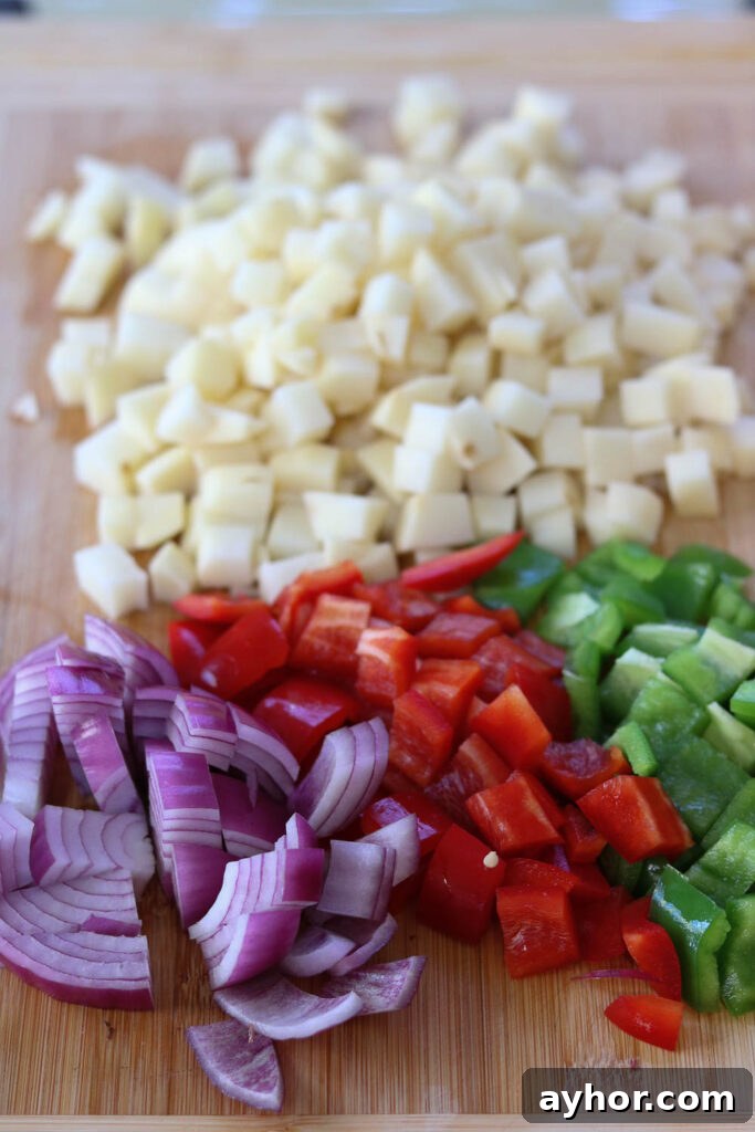 Cajun Potato Hash with Sausage and Peppers 3 potatoes peppers onions and chopped for hash