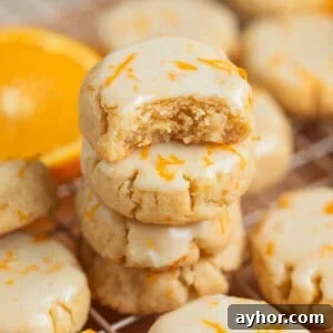 Stack of gluten free almond flour cookies with bite taken out of top cookie.