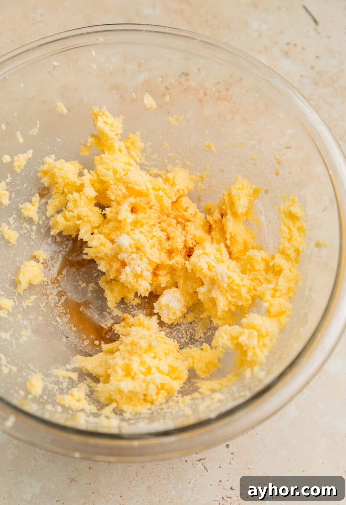 Creamed butter and sugar in glass bowl with salt and vanilla added.