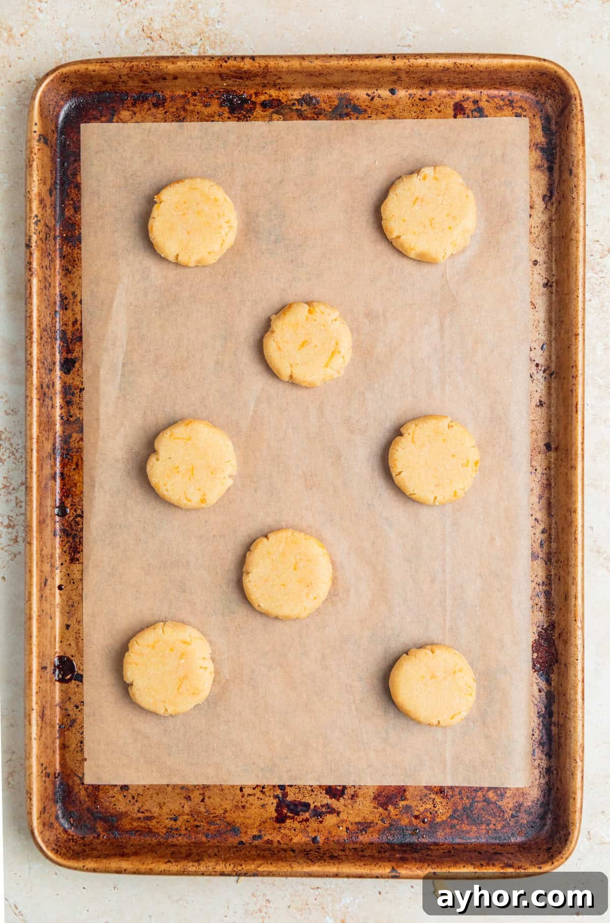 Pressed cookie dough on cookie sheet.