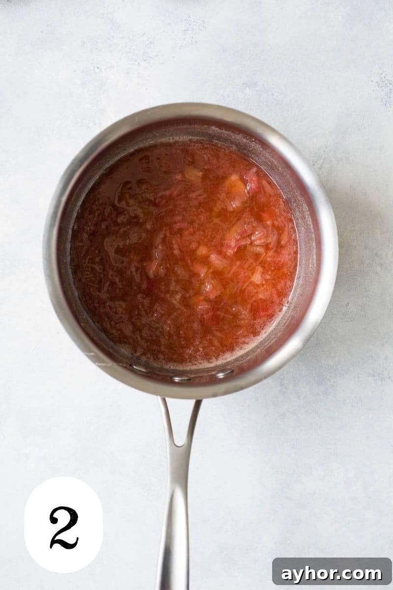 Rhubarb Bourbon Sour: Spring Cocktail Recipe with Rye Twist 5 Cooked syrup in a saucepan.