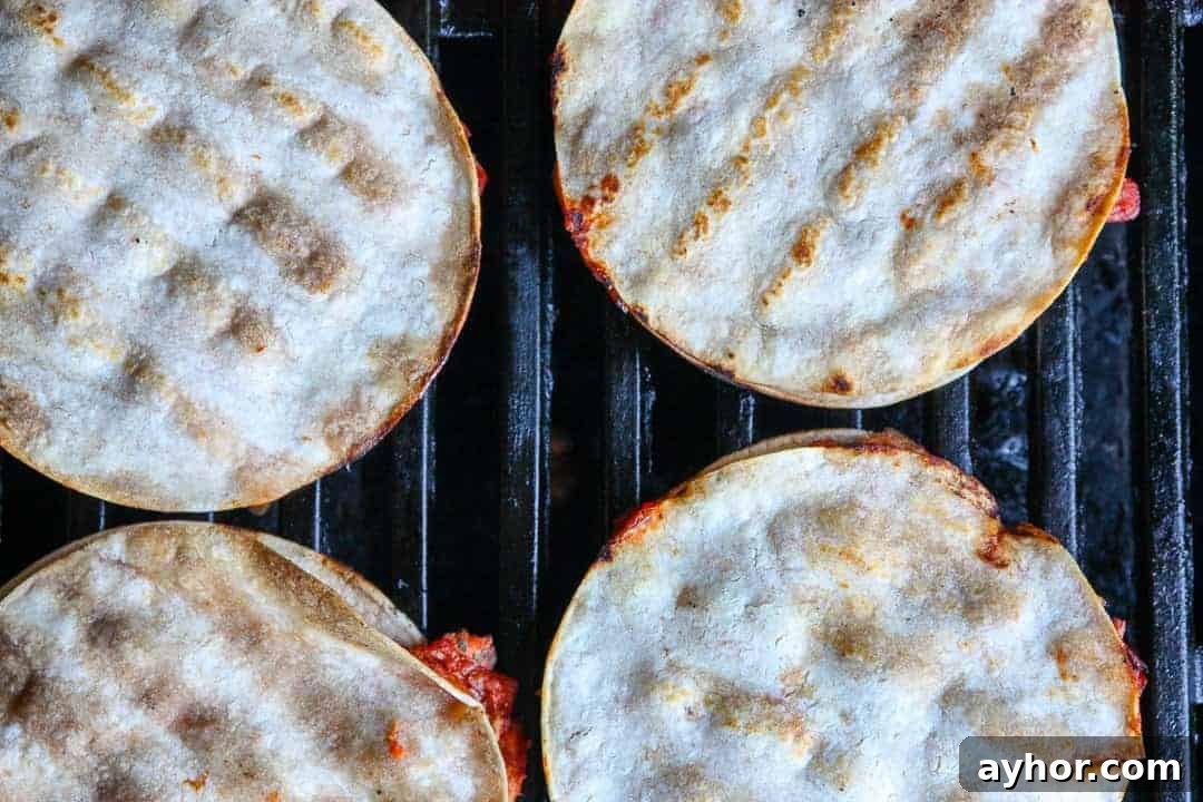 Spicy Sriracha Salmon Quesadillas Recipe 3 A close up of a tortillas on a grill