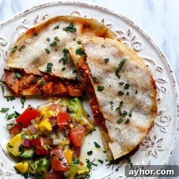 Spicy Sriracha Salmon Quesadillas Recipe 5 A plate of food with a with Quesadillas and Salsa