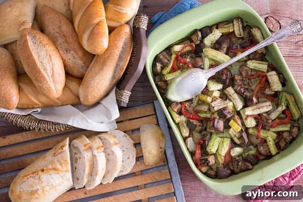 10 Key Facts About Living Gluten-Free: What You Should Know 4 Image, taken from above, shows a large tray of grilled vegetables with a basket of rolls and a loaf of sliced bread sitting next to it.