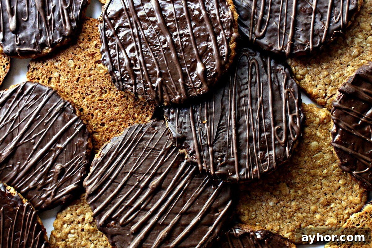 Chocolate-Covered Hobnob Oat Cookies Recipe 3 Closeup of chocolate coating on cookies with zigzags of chocolate on top.