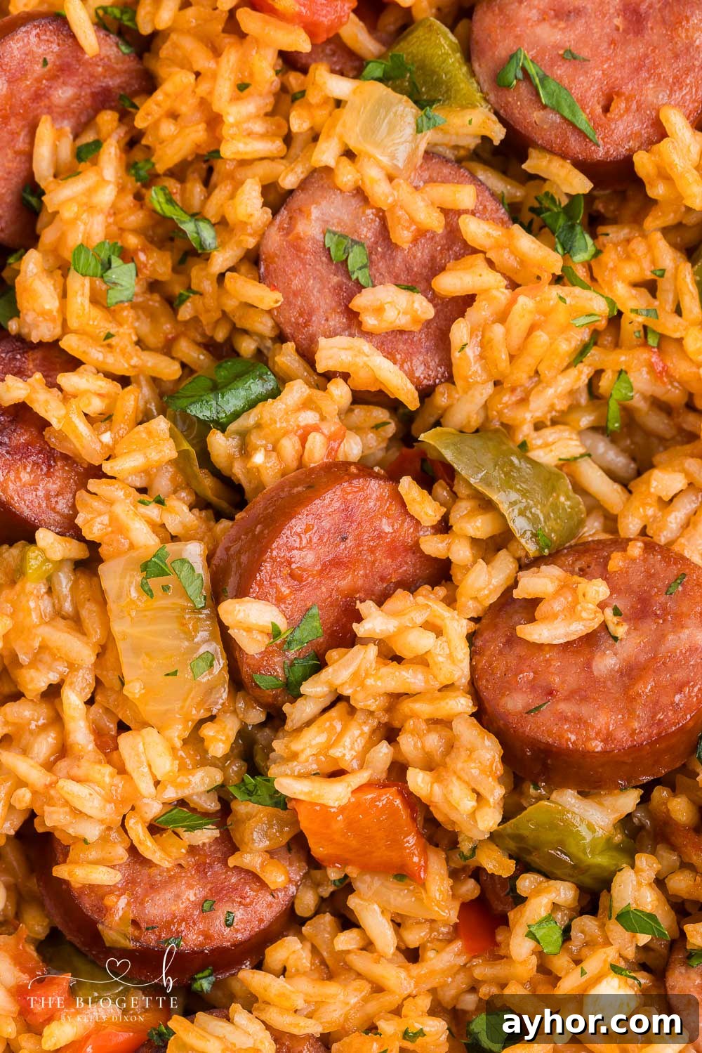 This Sausage and Rice Skillet features smoky sausage sizzled with sweet bell pepper, onions, and garlic in vibrant tomato sauce.
