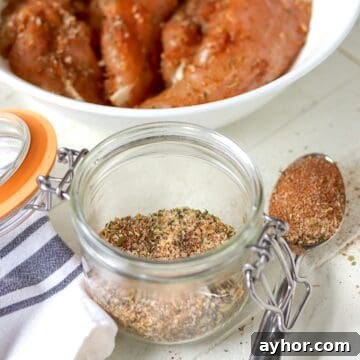 Montreal chicken seasoning blend in a clear glass jar.