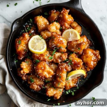 Sticky Chinese lemon chicken in a pan