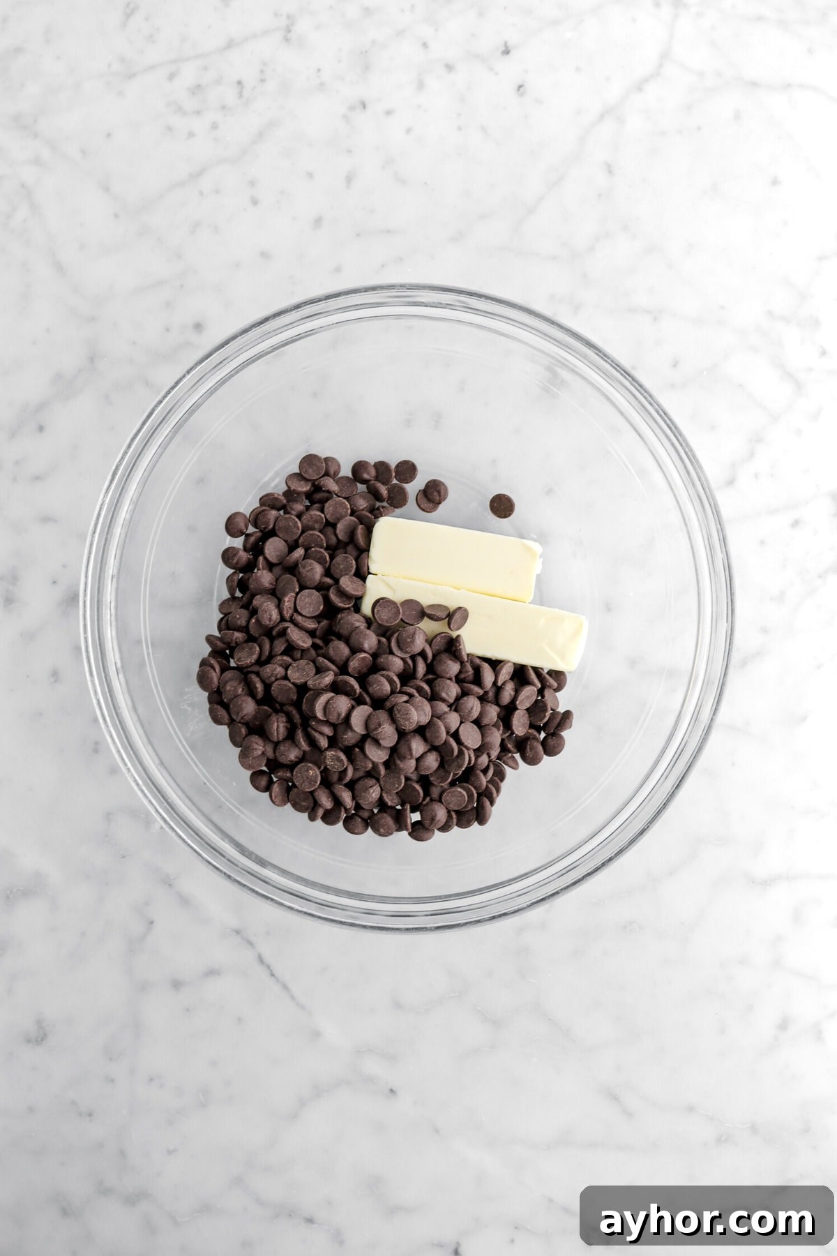 chocolate chips and butter in glass bowl.