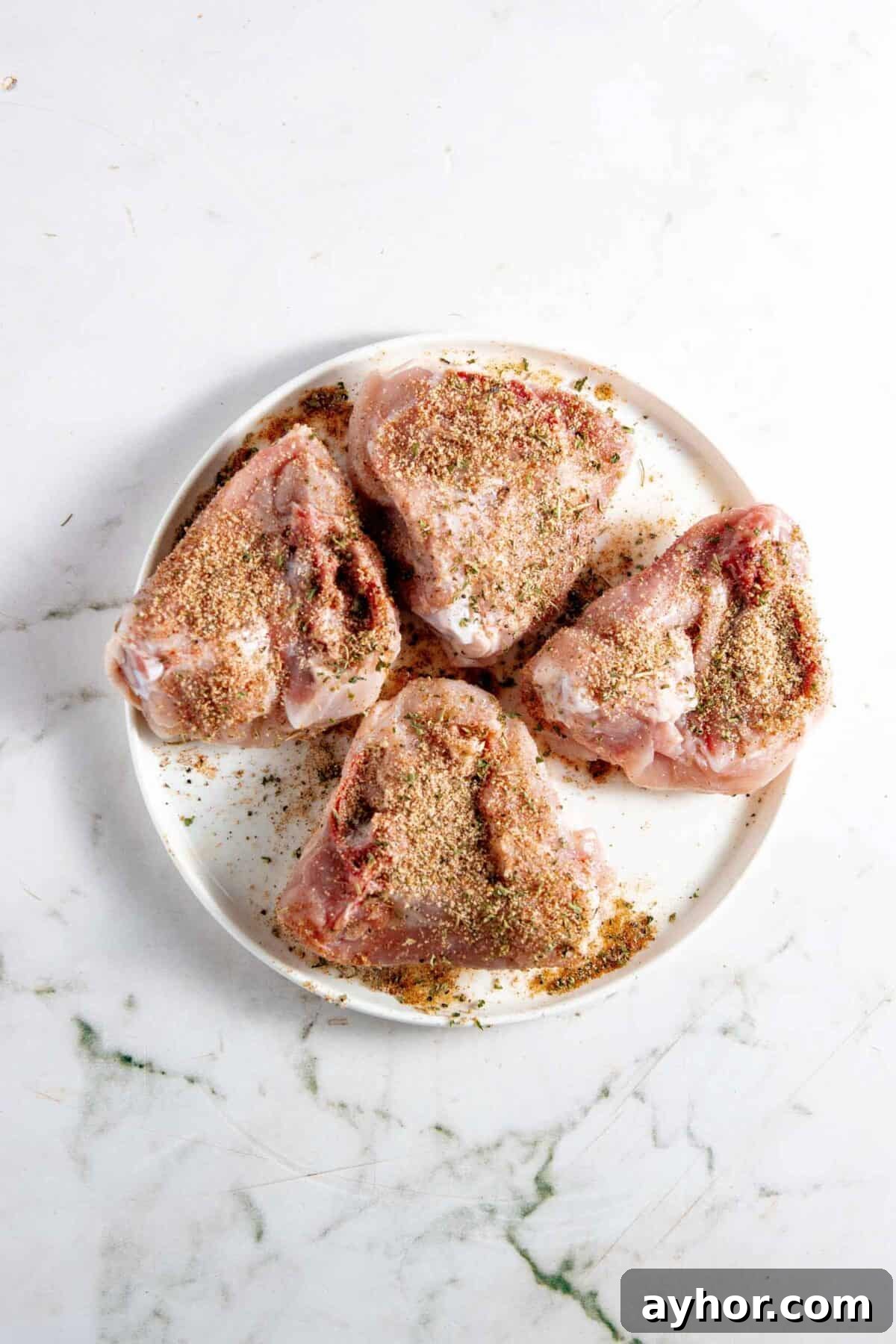 Chicken thighs rubbed with spices.