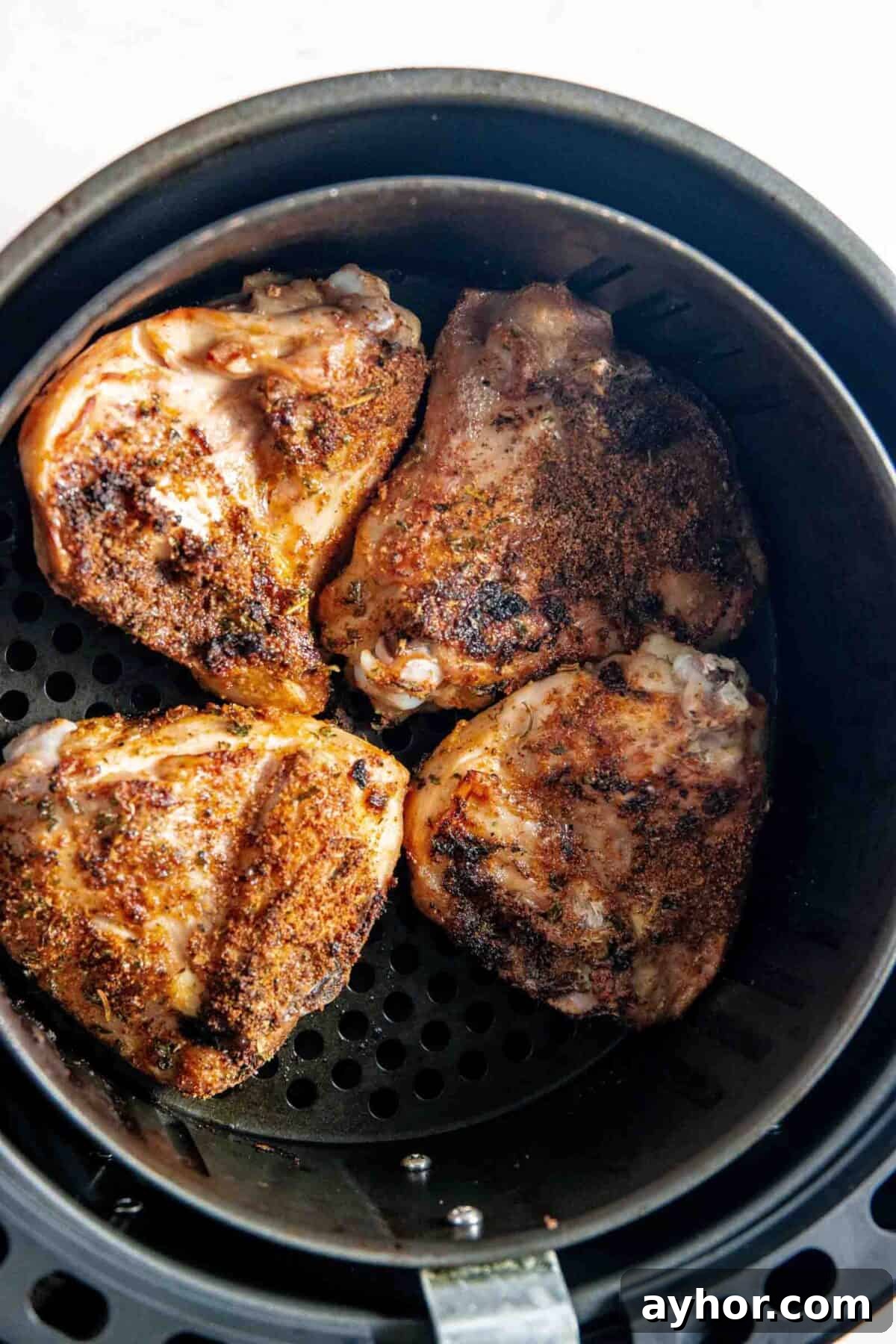 Golden brown thighs in the air fryer.